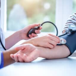 Doctor taking a patient's blood pressure