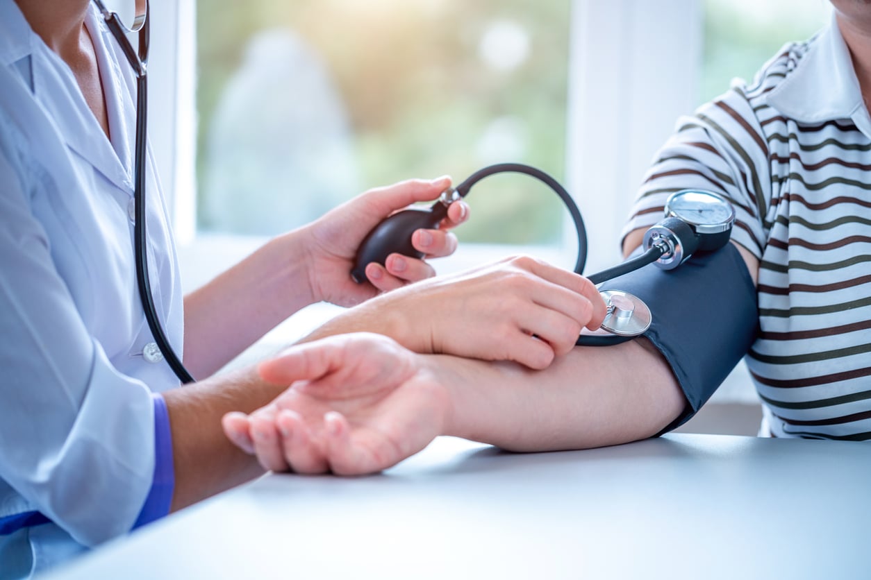 Doctor taking a patient's blood pressure